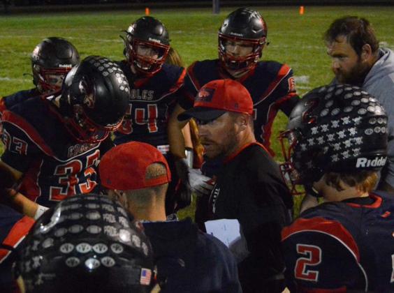 Clifton-Clyde head coach Russ Steinbrock huddles with his team during a first half timeout.