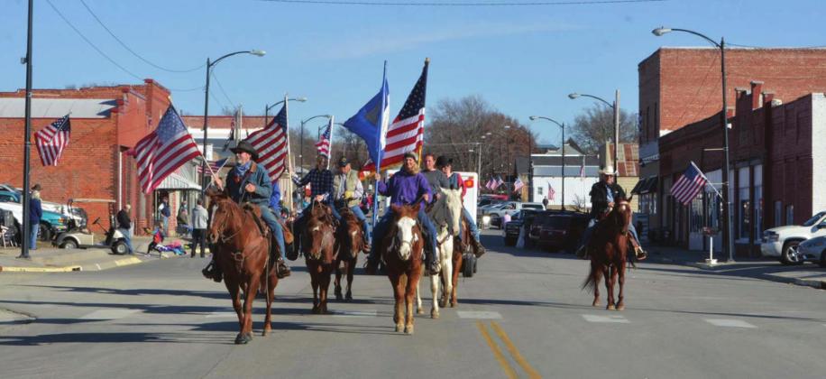 Riding horses and flying American flags at the end of the procession, the annual parade in Clifton helps recognize the hardships and sacrifice by veterans of the Unites States military.