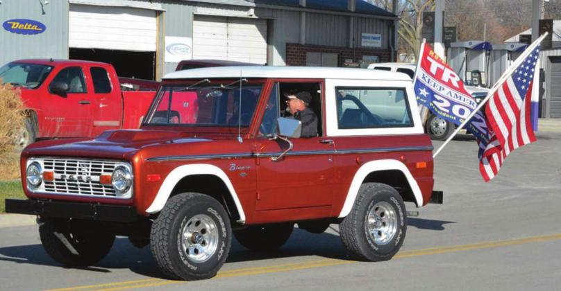 Greg Barnes drove his vintage Ford Bronco in the Veterans Day parade in Clifton on Wednesday, flying an American and Trump flag.
