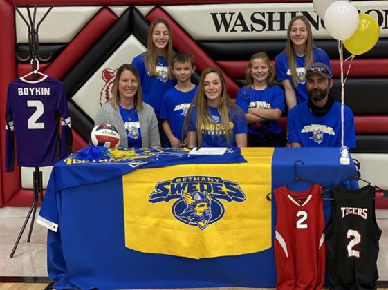 Camryn Boykin, center, signed a letter of intent to play volleyball for the Bethany Swedes this fall. She will also compete on the track team. She was joined in the signing by parents Jessica and Kevin Laflen, seated, and sophomore siblings Bri and Ali (the three would occasionally make up the entire front row for the Tigers, which Camryn said was a neat experience), and younger siblings Emma and Brycen.