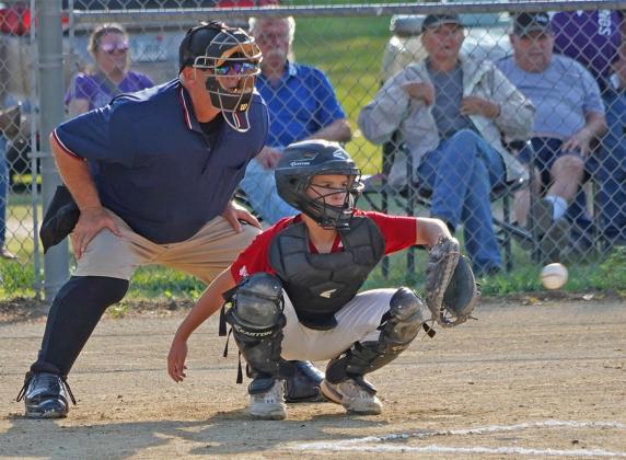 TJ Fralin watches for the pitch during Valley Heights’ game against Hanover on July 5 in Linn.