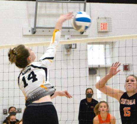 Linn’s Kendra Damman gets on top of the ball for a kill against Centralia in pool play.