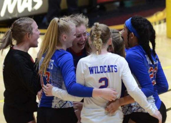 The Hanover team comes together to celebrate after getting the winning point against Attica on Saturday at the state volleyball tournament in Emporia.