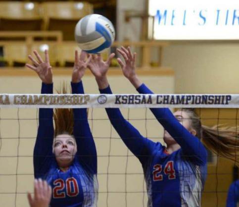 Avery Behrends, left, and Massey Holle go up for a double block during a state tournament game.