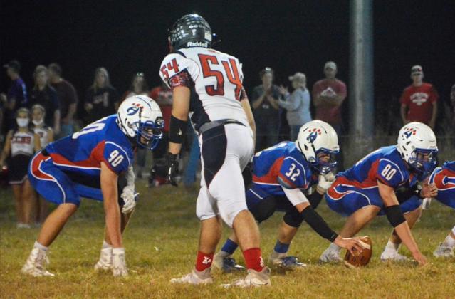The Hanover offensive line, including, from left, Blake Hynek, Philip Doebele and Jacob Klipp, get ready to block against the Clifton-Clyde defenders, including Jarik Weiche.