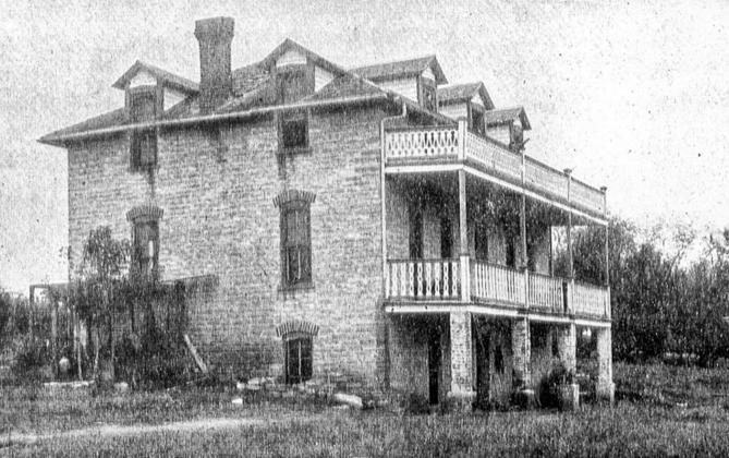 Double balconies on the east side of the Canfil house stretched the entire width of the stone house in this old, undated photo.