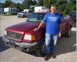 Jim Hornbostel, Palmer, drove over a million miles during his rural postal carrier career, which spanned 34 years. He retired at the end of August. He is pictured with his final pickup. He drove 14 vehicles into the ground as part of the job.
