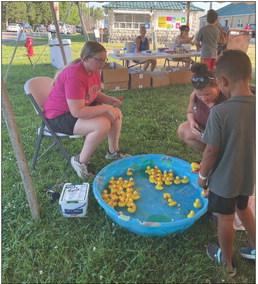 Linn FBLA members helped run the carnival games at the county fair in July (above). 