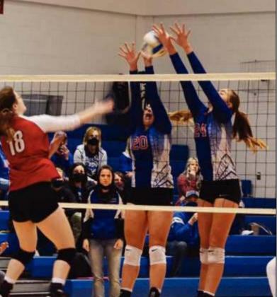 Avery Behrends and Massey Holle get up for a double-block against a Wetmore hitter in the finals of the substate championship game on Saturday in Axtell. The Wildcats swept the competition and qualified for the state tourney. Photos by JULIE PERRY, MARYSVILLE ADVOCATE