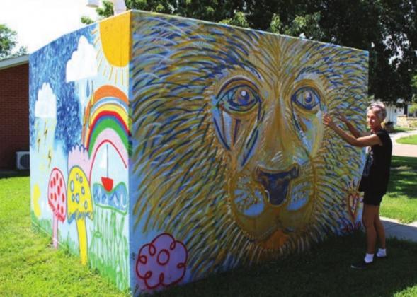 A lion was drawn free-hand, as was every piece of art in Amy Kern’s summer effort. Just a paint brush and paint buckets were used.