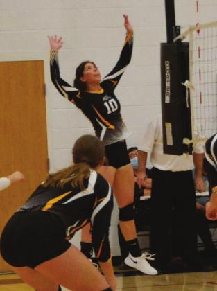 Linn senior Kaily Weiche goes up for a spike in a semi-final game against Hanover.