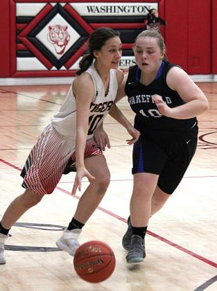 Nina Kern drives against a Wakefield defender in the Tigers’ game on Friday. The boys did not play against Wakefield because the team was in quarantine.