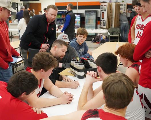 Washington County head coach Bobby Smith draws up a plan of action during a half time break at the TVL tournament in Onaga.