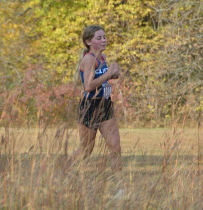 Ella Steinbrock, a Clifton-Clyde senior, makes her way through the course at Leonardville. She placed 45th in the event.