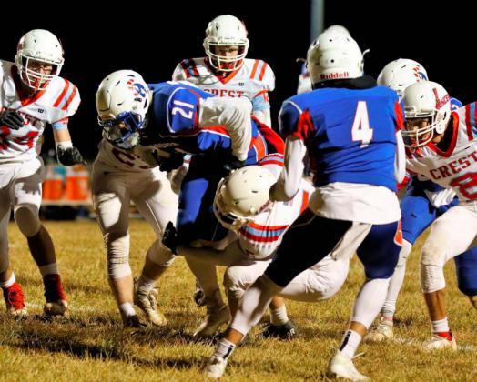 Colin Jueneman powers through the Colony-Crest defense during Friday’s sectionals playoff game at Hanover. Jueneman had 47 yards rushing and two touchdowns, while gaining 61 yards receiving for the Wildcats.